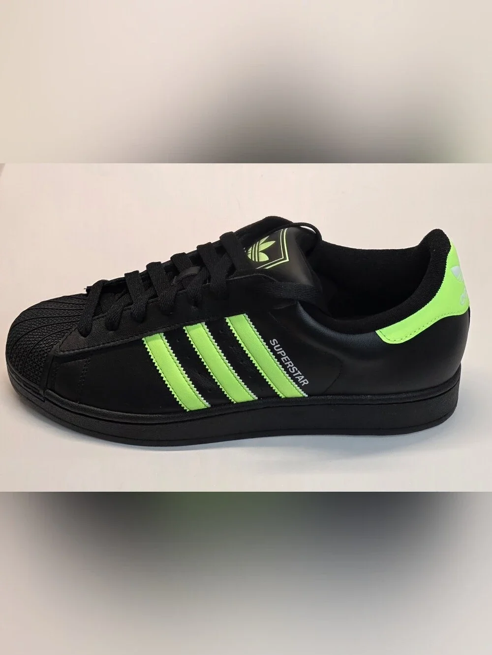 adidas Men’s Black Sneakers with Neon Green Stripes